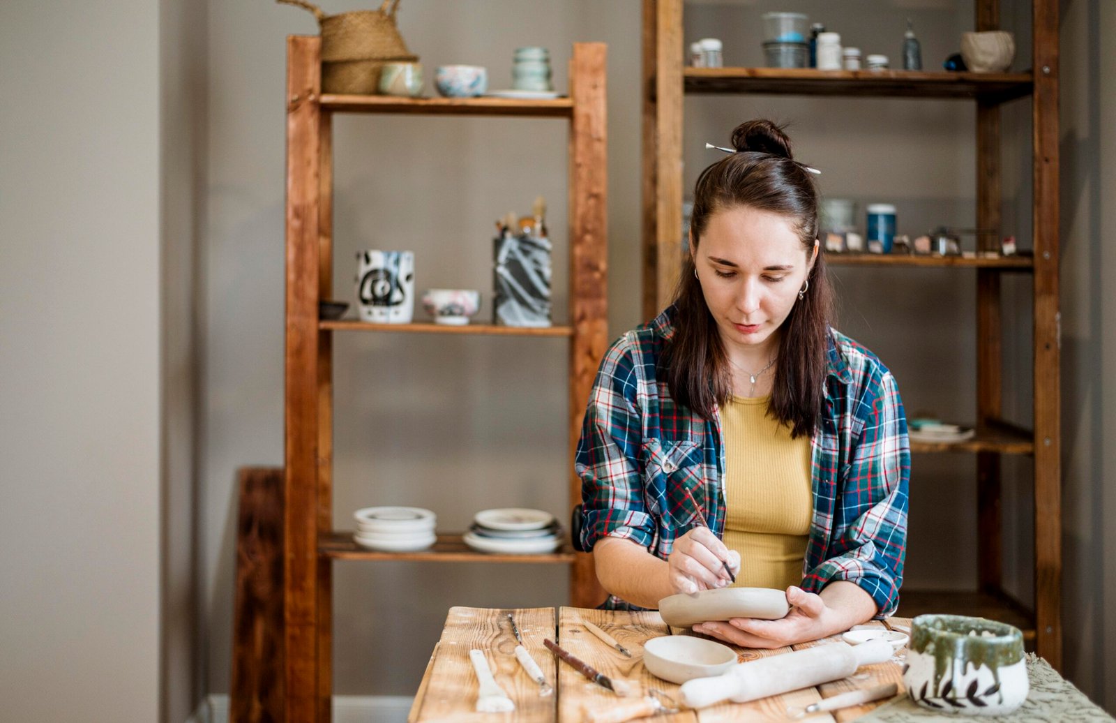 woman working her pottery workshop.jpg